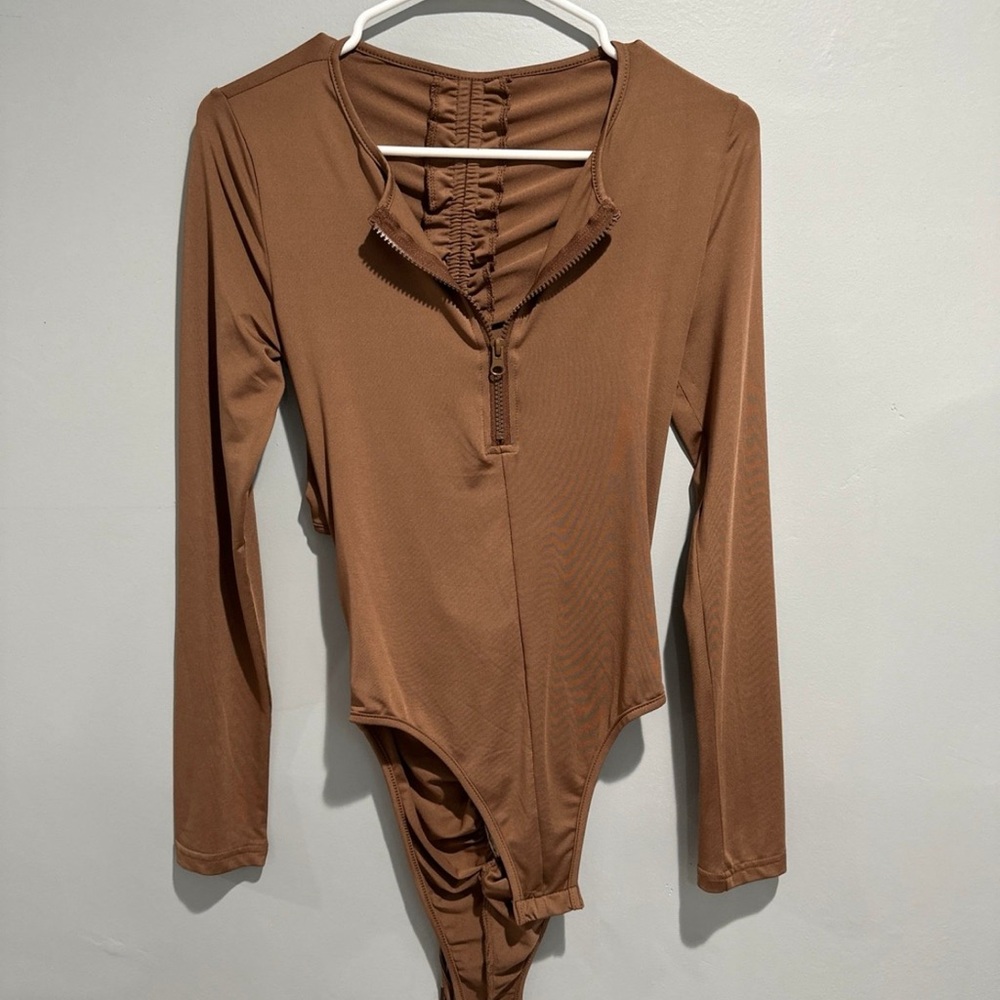 Beige bodysuit with back cut out